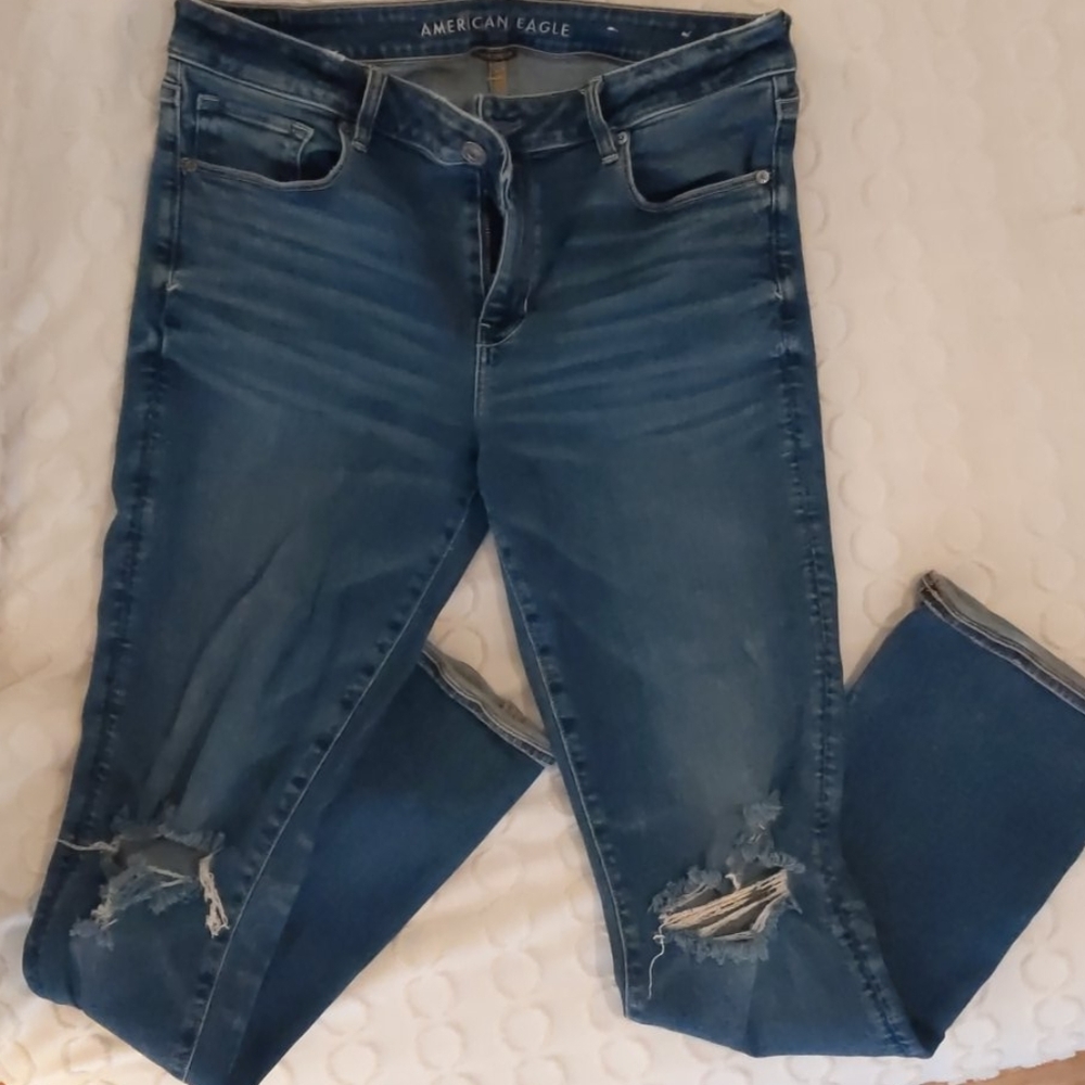 Distressed skinny kick stretch jeans